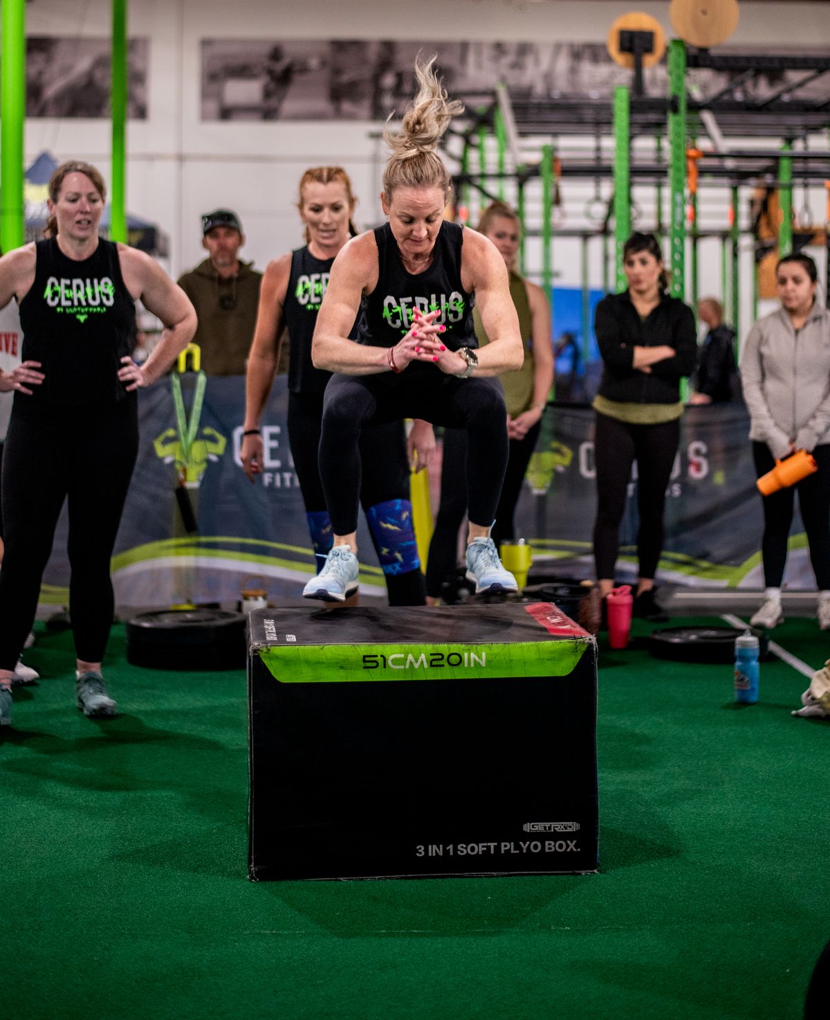Cerus Fitness members performing box jumps during a coached HIIT conditioning class