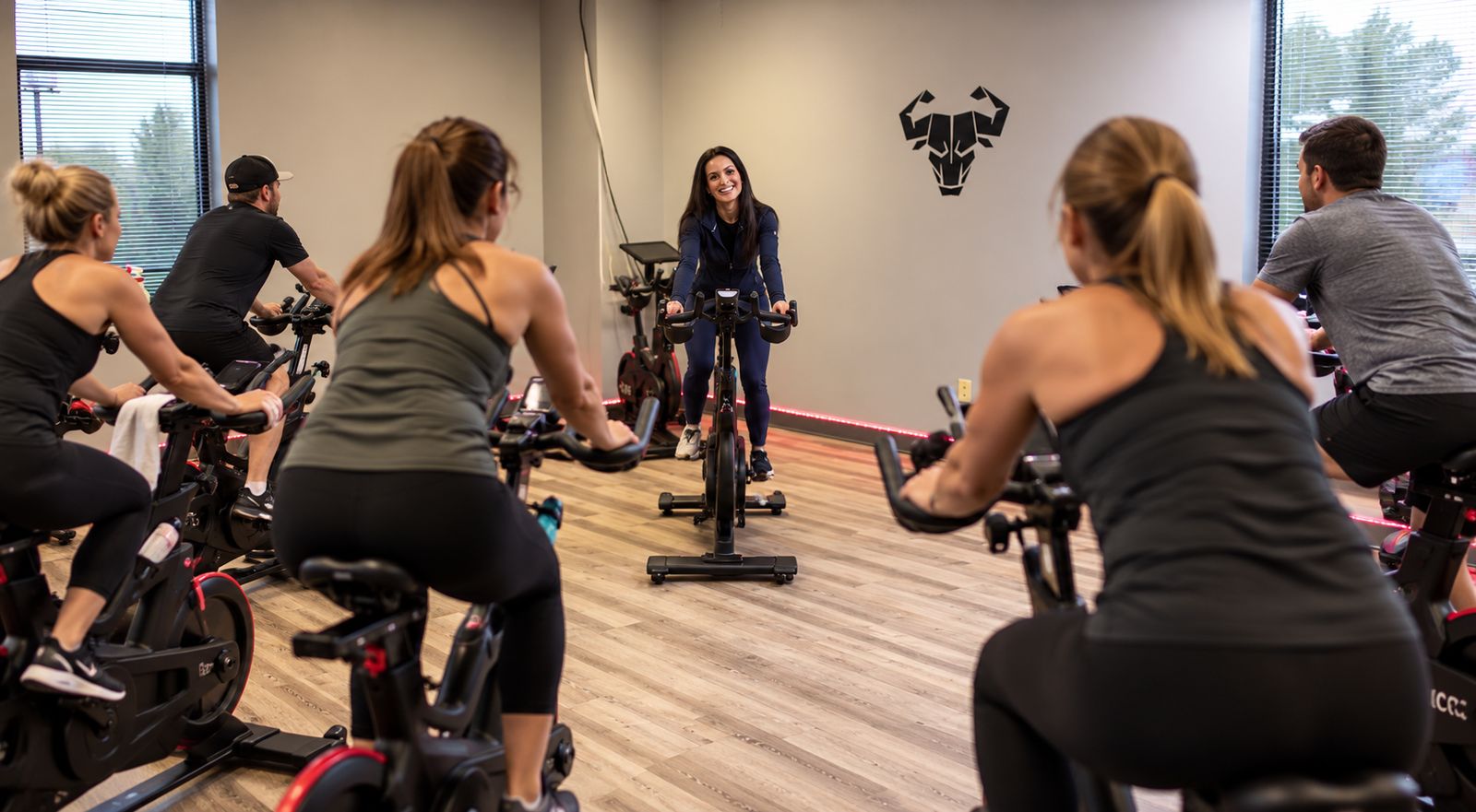 Cerus Fitness instructor leading a group indoor cycling class